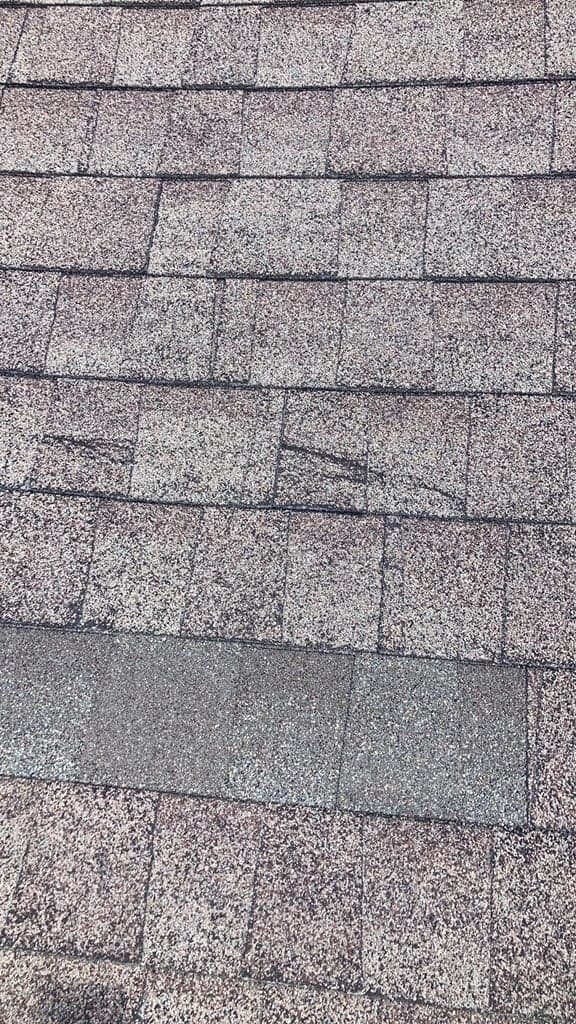 Asphalt shingle field showing colour and granule variation across weathered courses