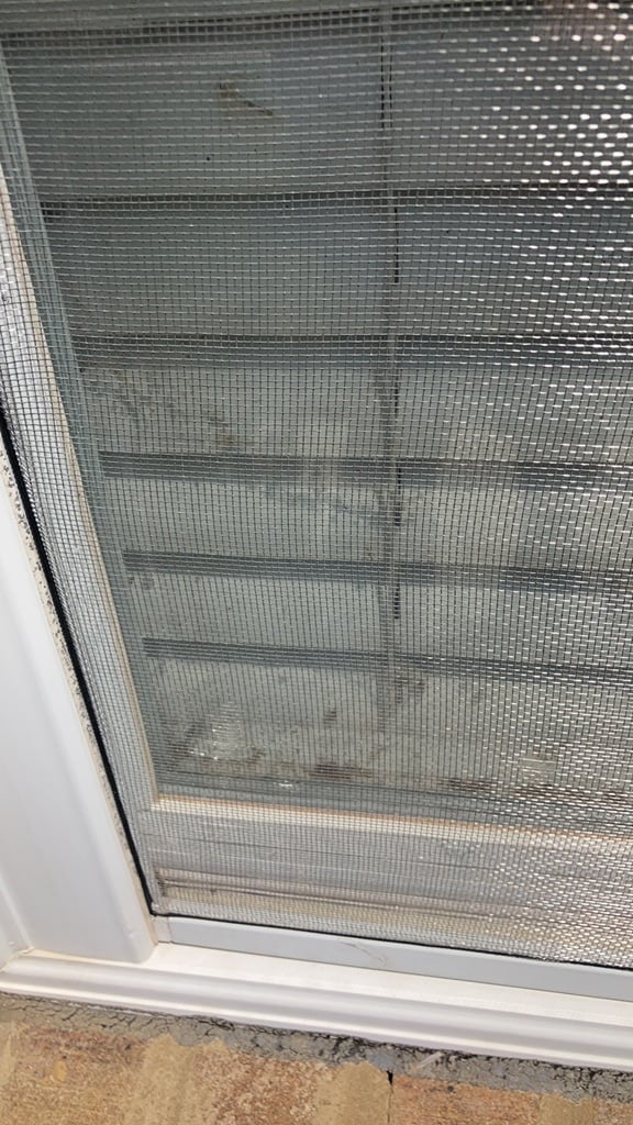 Hail impact dimpling an aluminium window screen frame